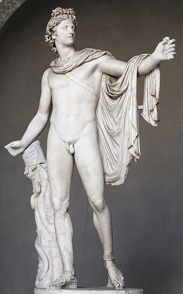 Apollo is carved from marble. He is nude with a cape over his shoulders and draped over his outstretched left arm.