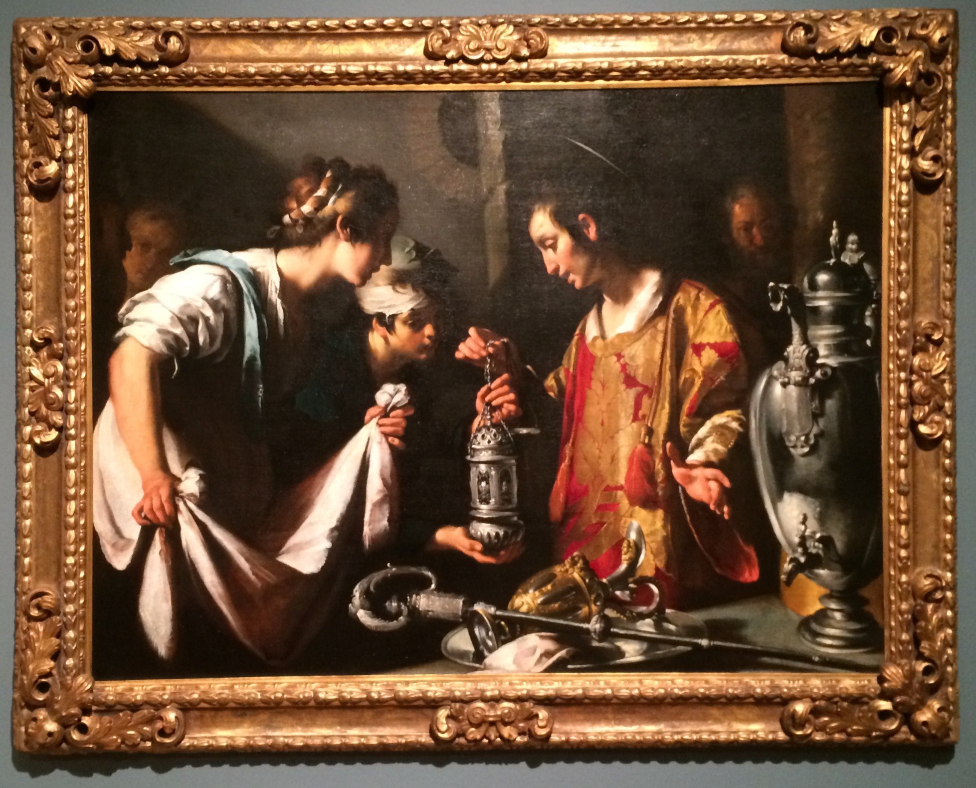 A Renaissance painting of Laurence giving precious objects to the poor.