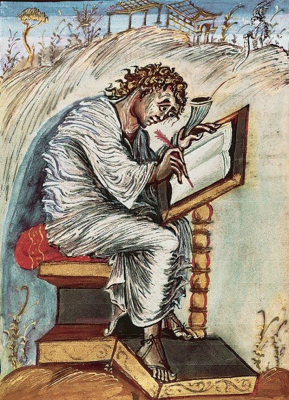 An image of Matthew bent over a small table and writing in a book. Refer to the text for details.