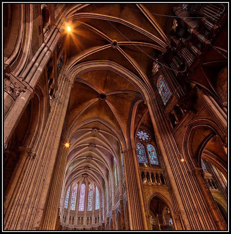 Towering vaults make room for stained glass.