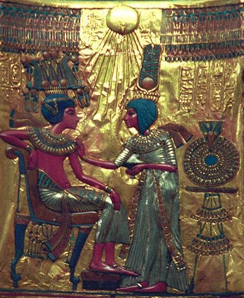 The back of Tutankhamen’s throne is brightly enameled on gold. The style is a mix of the pre-Akhenaten style and Akhenaten’s more realistic style.