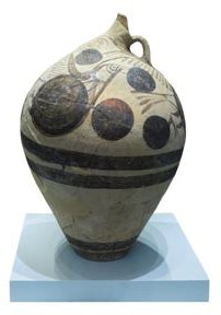 An ewer with stylized birds that appear to be made of circles.