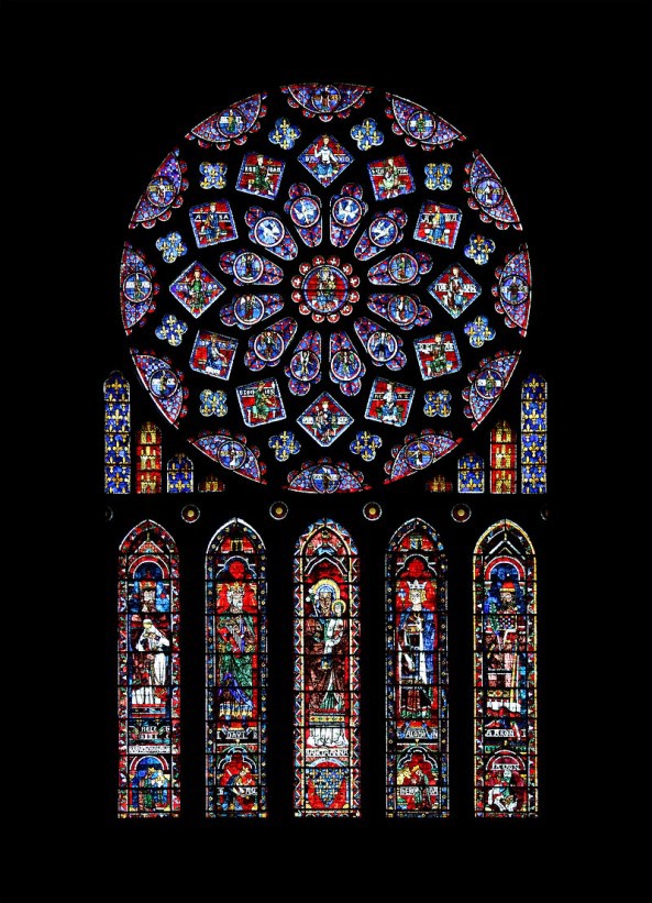 A rose window with lancet windows below it. Smaller lancets are on each side of the lower portion of the rose window. Refer to the text for details.