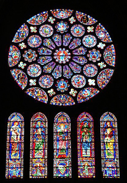 A rose window with lancet windows below it. Refer to the text for details.