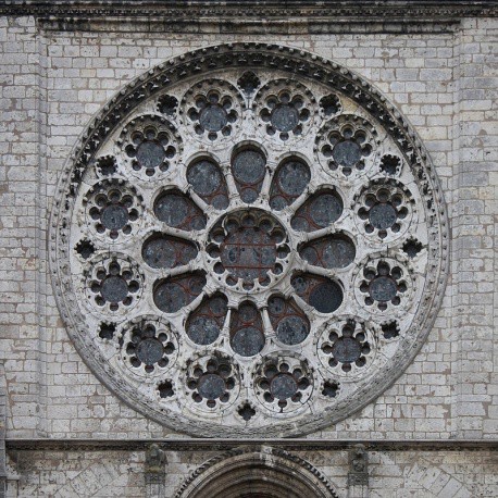 The stonework that supports the exterior of the rose window.