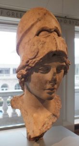 A bust of an idealized woman with a Greek helmet on her head.