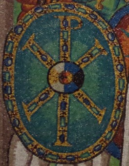 Shield with the Greek letter Rho and the Greek letter Chi overlapping each other.