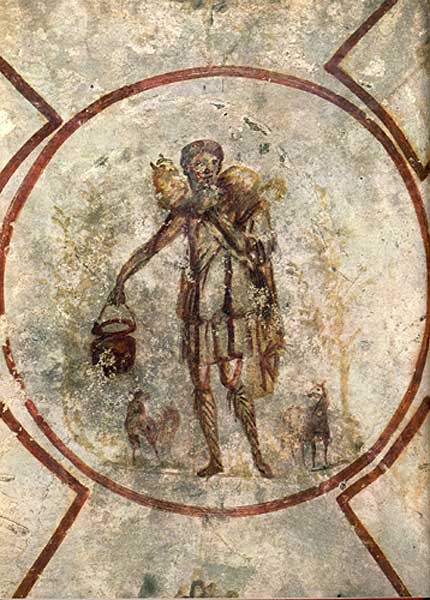 A circle with the painting of a man carrying a sheep around his shoulders. There are sheep at his feet, and he carries a bucket.