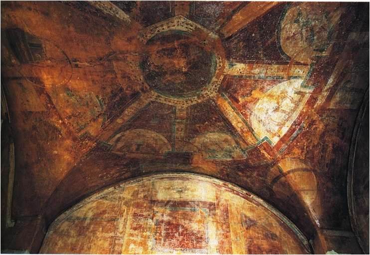 A ceiling fresco of a spoked wheel containing other images.
