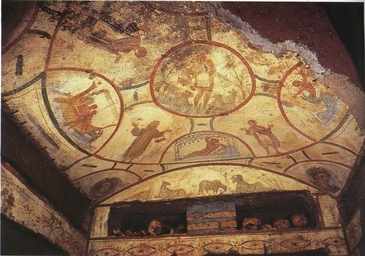 A ceiling fresco of a spoked wheel containing other images.