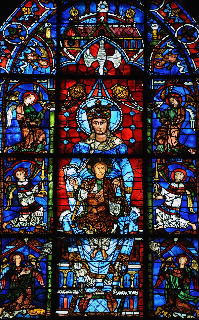 A close-up of the child on his mother Mary’s lap. Angels fill the sections beside this image.