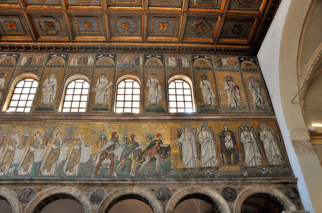 Three well-dressed men lead the procession of women toward the enthroned Mary.