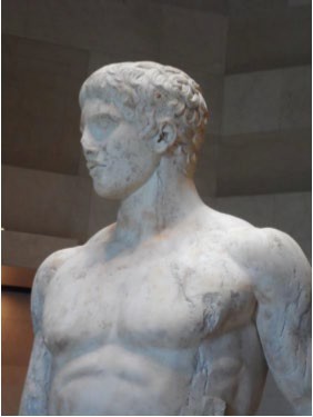 Close-up of the head and torso of the Spear Bearer.