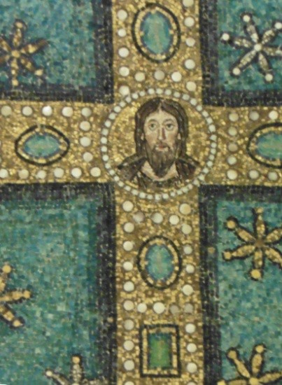 A close-up of the bearded Christ in the cross.