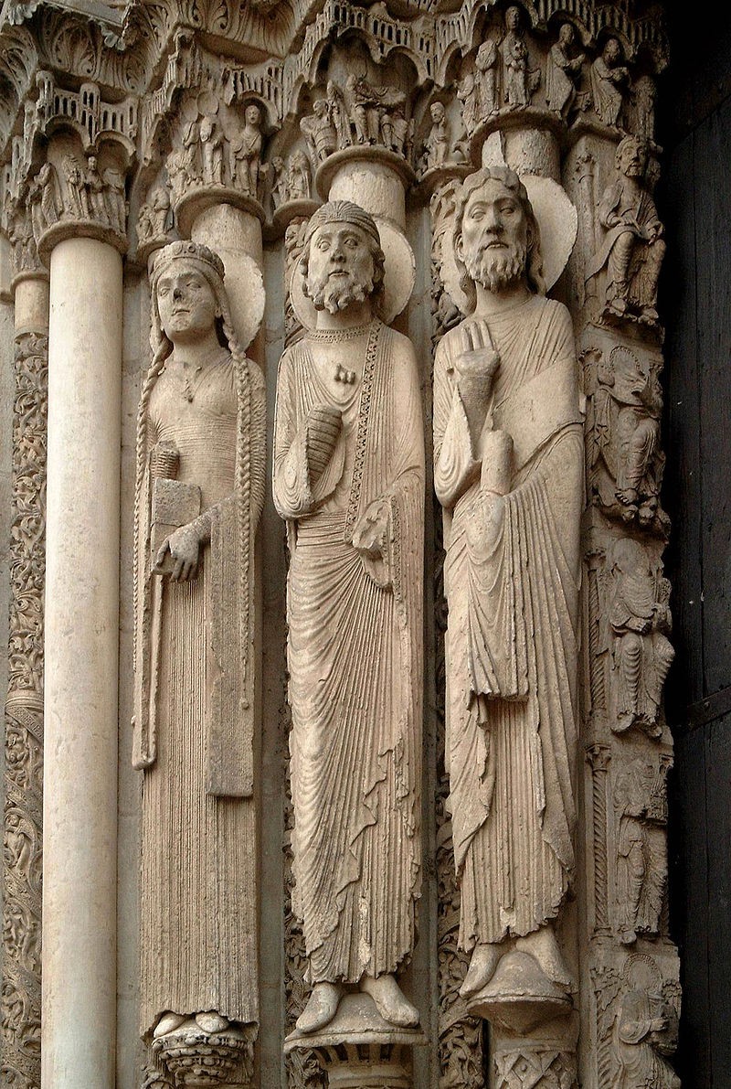 Columns of the door-jam. Each has a tall, stiff figure carved into it. Refer to the text for details.