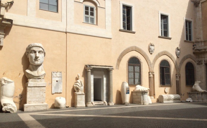 Remains of Constantine’s statue sitting along a wall.
