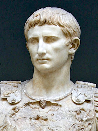 The idealized natural looking carved head of Augustus. He is young and beautiful and shows little facial expression.