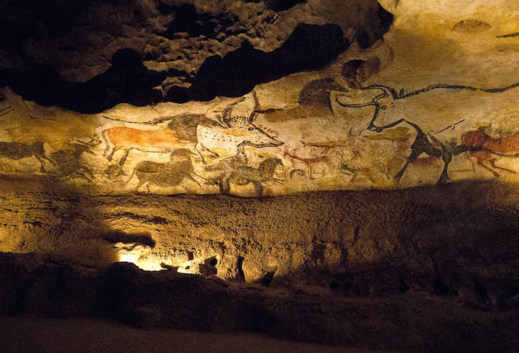 Cave painting of hoofed animals in a cave.