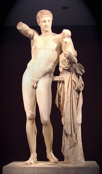 A tall, lean, nude man holding a baby on one hand and holding the other now missing hand in the air. Refer to the text for details.