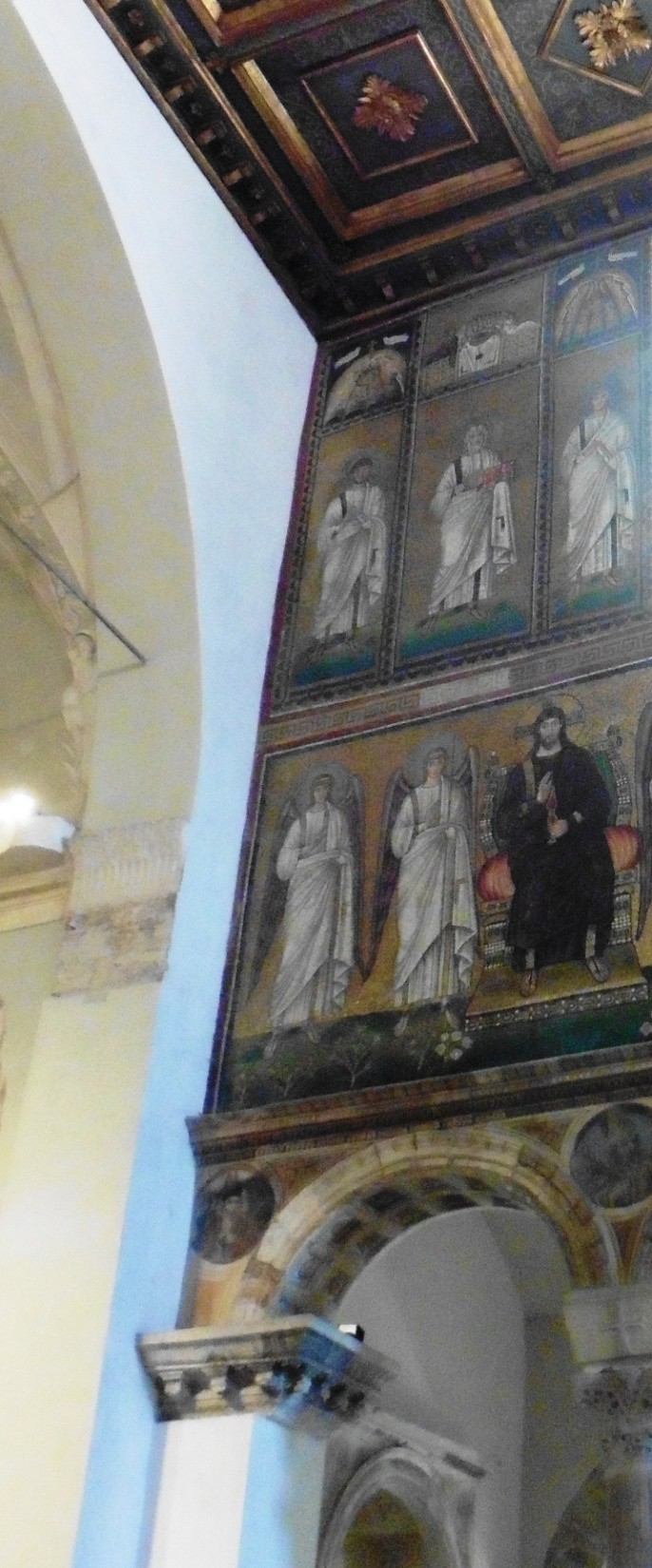 A mosaic with Jesus on a throne. He is bearded.