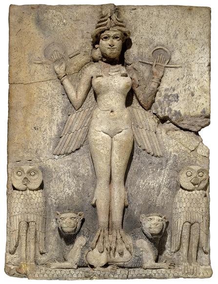 A bas relief of a nude woman with wings standing on tiny lions with a large owl on each side.