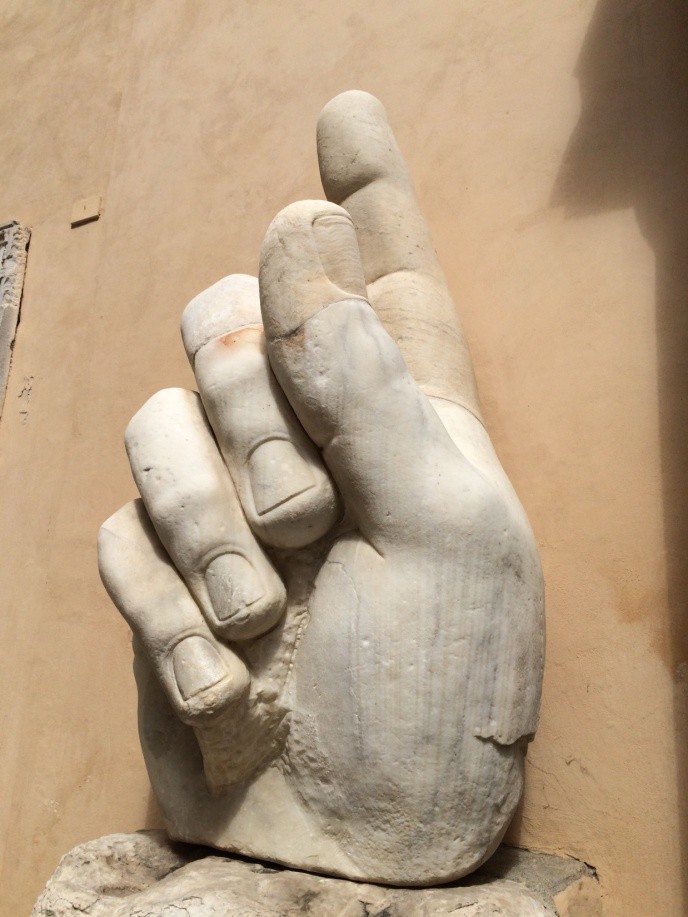 The hand of Constantine pointing up.