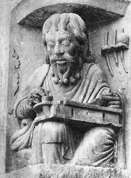 A detail of Aristotle using a lap desk.