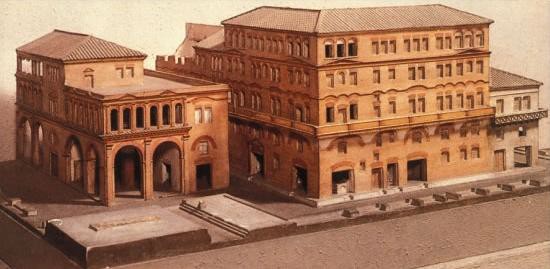 A scale model of Etruscan apartment buildings built of stone blocks. They are multi-storied and use arches to support the weight of upper stories.