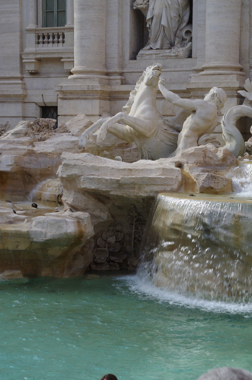 A Renaissance fountain with Poseidon and a horse.