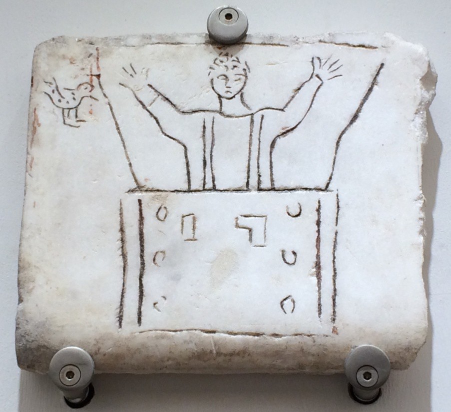 A crudely carved funerary slab depicting Noah, a dove and his arc. His hands are raised in a prayer position.