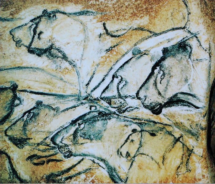 Cave drawing of multiple lion heads.