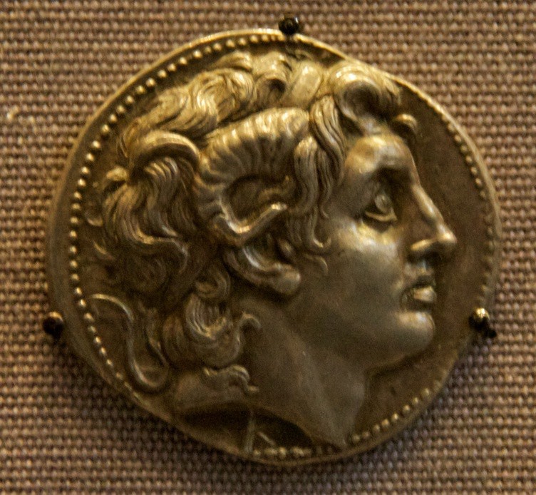 A gold coin with the face of Alexander on it. This image is probably more accurate than the carving seen above as it is not idealized to resemble Apollo.