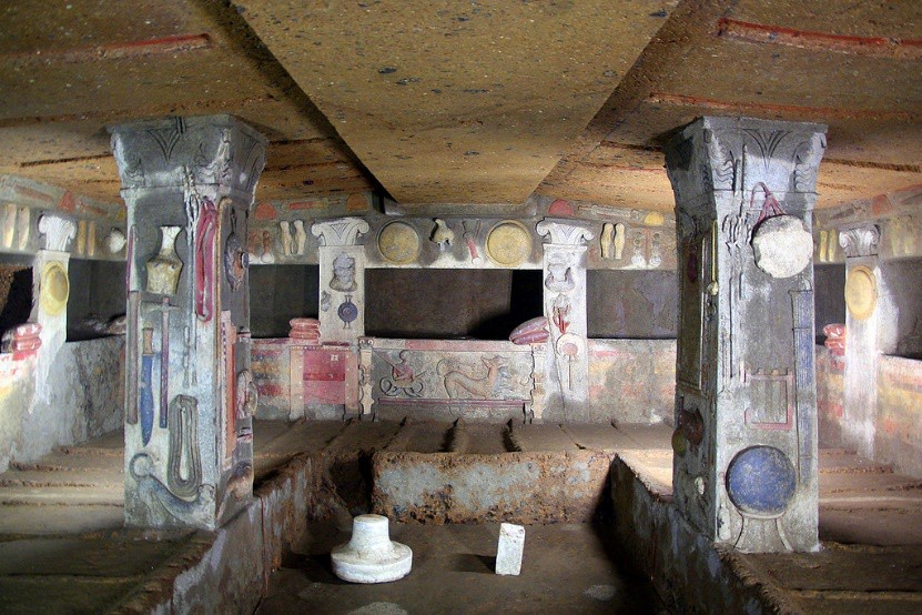 A phot of the interior of a tomb, which resembles a home, complete with every-day objects that might be needed in the next life.