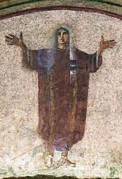 A painting of a person, wearing a loose robe who raises her hands in prayer position.