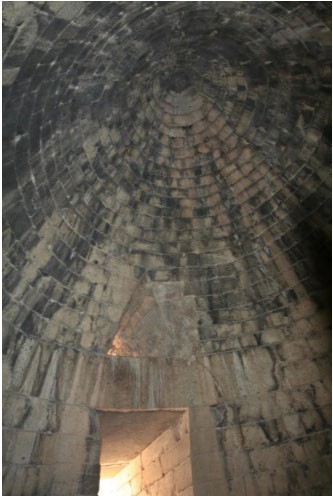 A view looking up at the corbelled ceiling of the tomb.