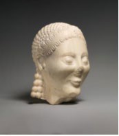 The marble head of a kouros with a smile on its face.