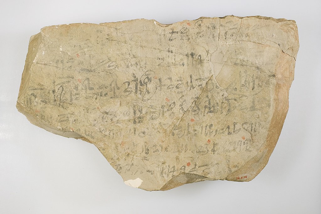 Image of a potsherd, used as a writing surface. This one is written in Hieratic script, the cursive of ancient Egypt.