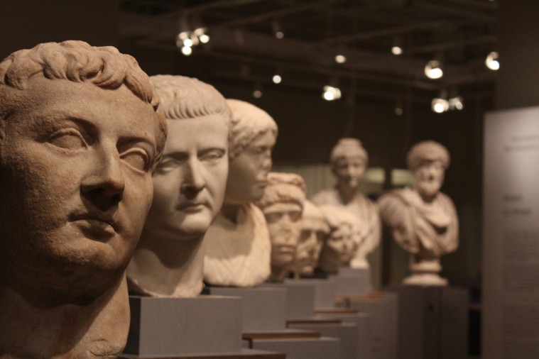 A row of portrait busts some bearded and some with bare faces.
