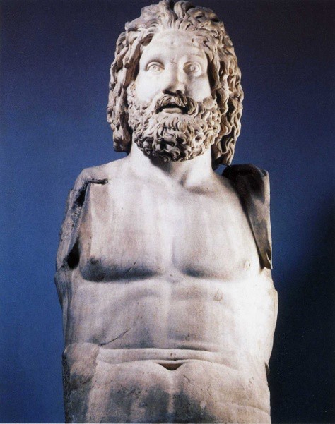 The powerful torso of a nude, bearded man. His arms are now missing.