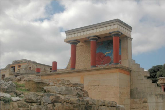 A brightly painted section of a porch with a fresco.