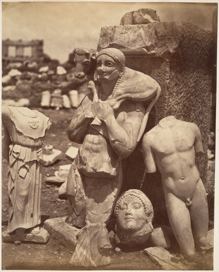 An old photo of the excavation of Kritios Boy and other statuary. Next to other Archaic statues that were found with him, Kritios Boy is more natural.