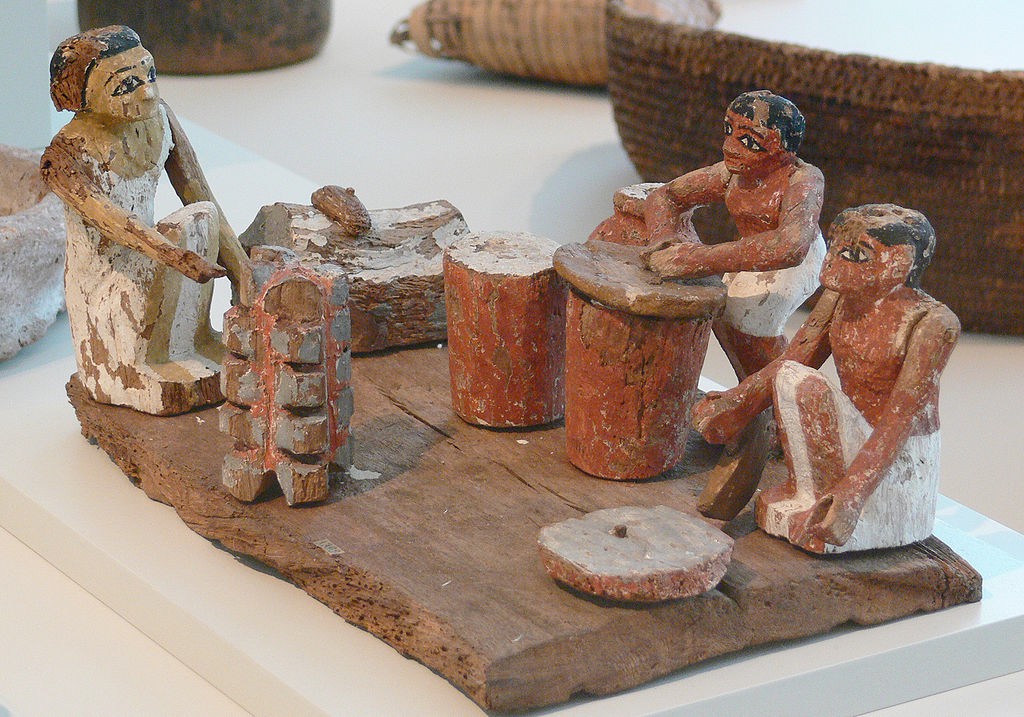 Female figurines doing every-day activities.