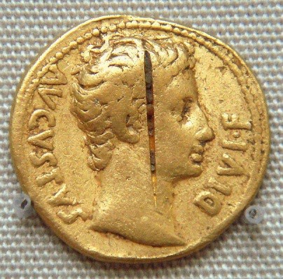 A gold coin with the profile of Augustus wearing a civic crown. The image is idealized.