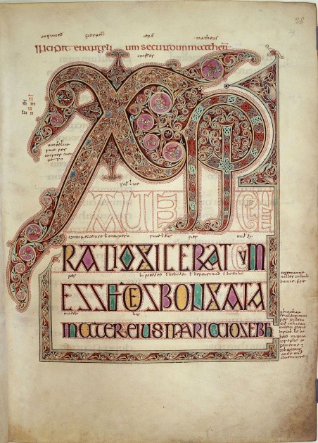 Elaborately illuminated letters representing the title of Christ.