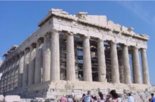 A comparative view of the Parthenon with its round, fluted pillars, single story, gabled roof and steps.