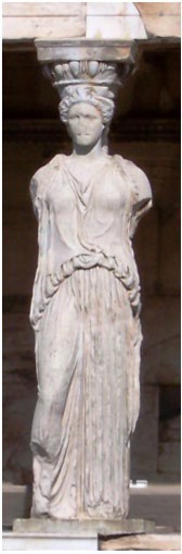 A pillar carved to look like a woman who stands in a contrapposto pose. Her arms, probably making an offering, are now missing.