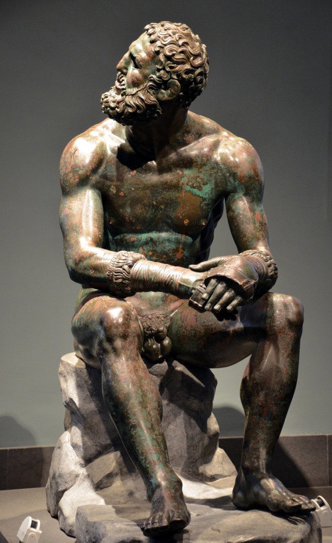 A middle-aged nude man sits turning his head to the side.