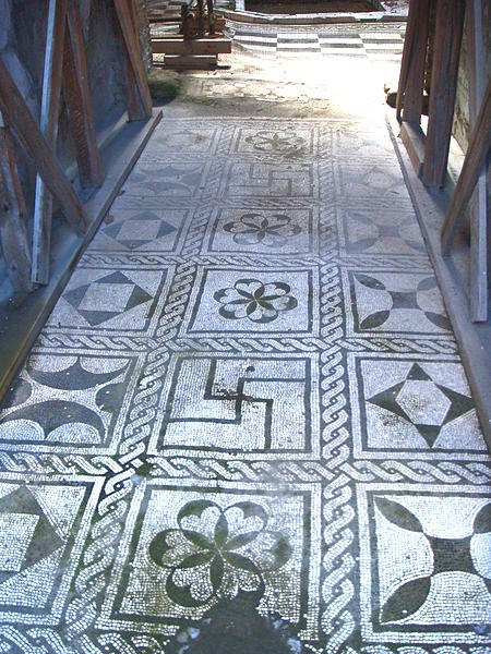 A floor tiled in geometric designs.