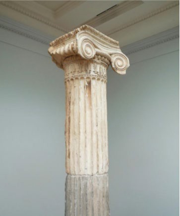 A photo of an ionic pillar with a scrolled capital.