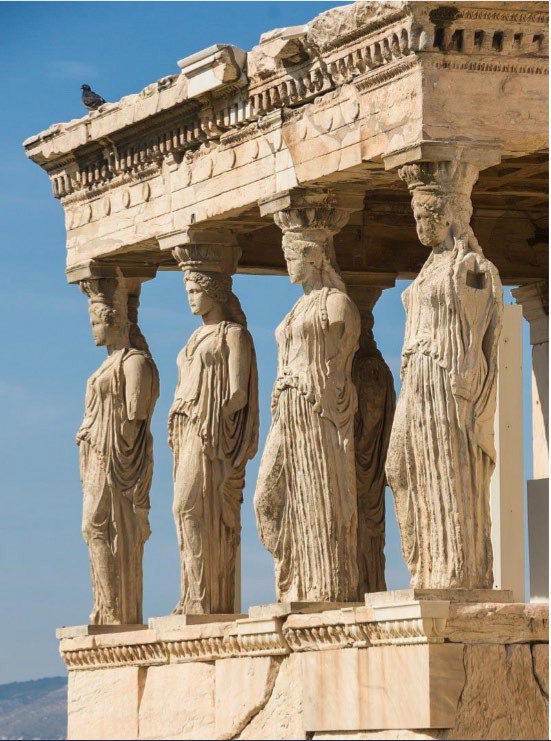 Four Caryatids holding up the porch roof. Each is slightly different but the overall effect is symmetrical as the women on the right stand with the left knees forward, while the two on the left stand with the right knees forward.